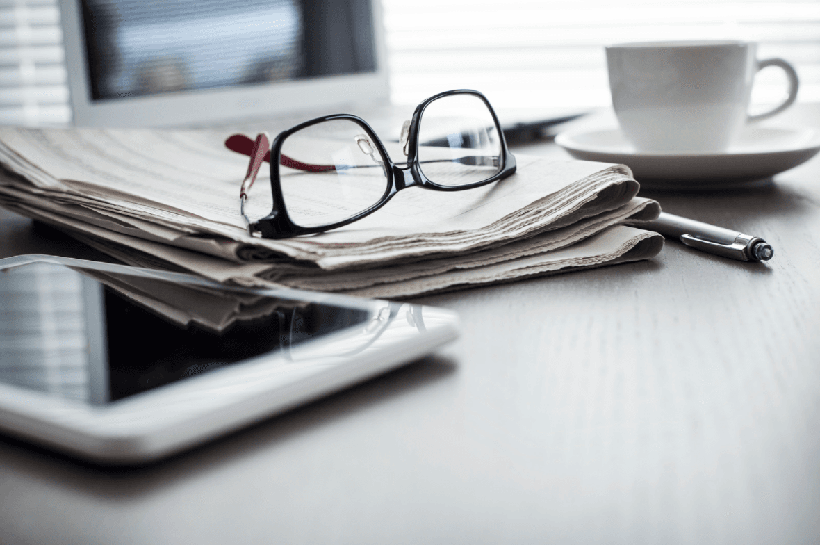 newspaper and glasses