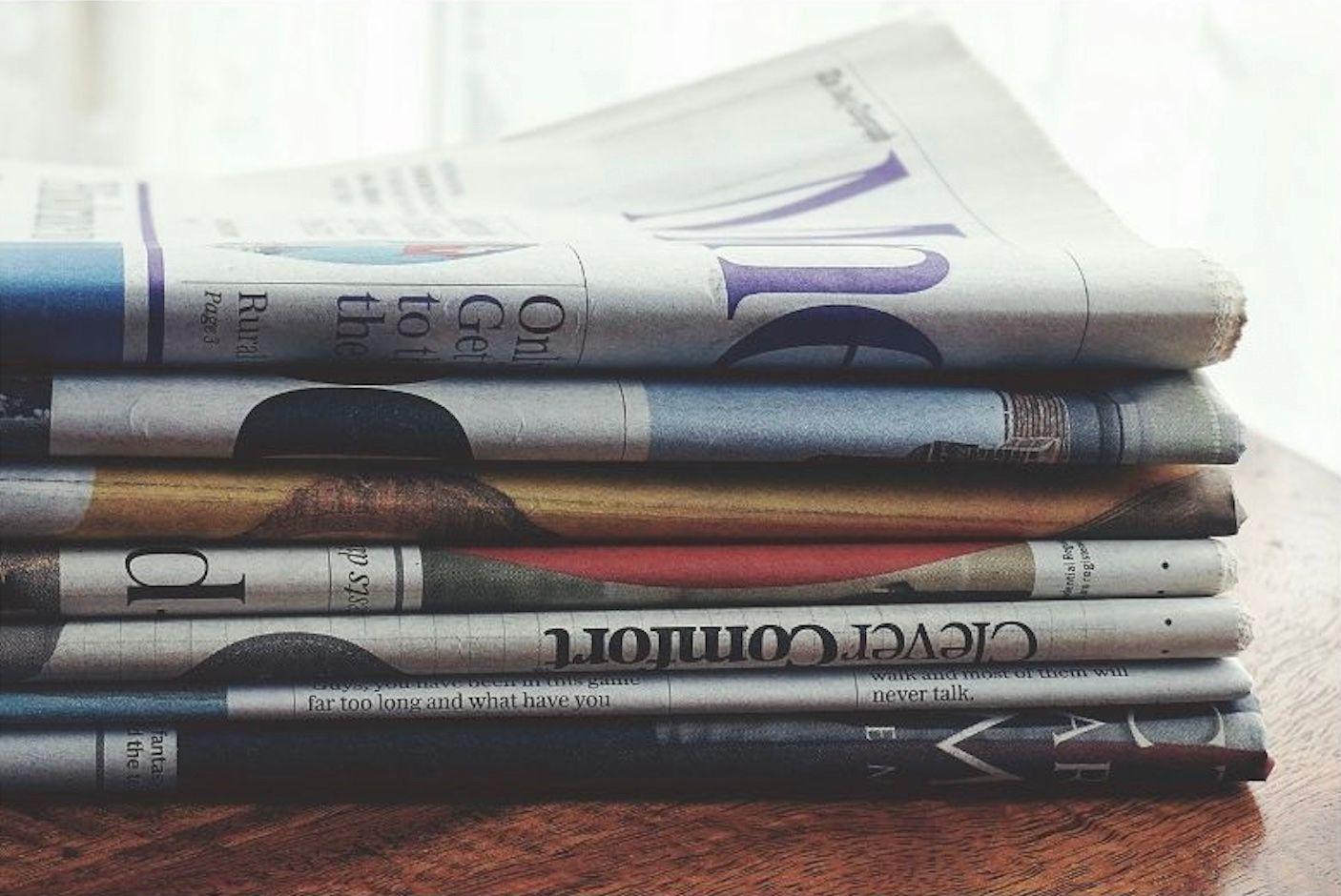 newspaper stack on table