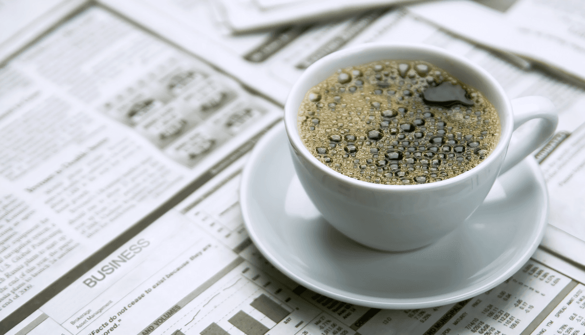 newspaper and cup of coffee